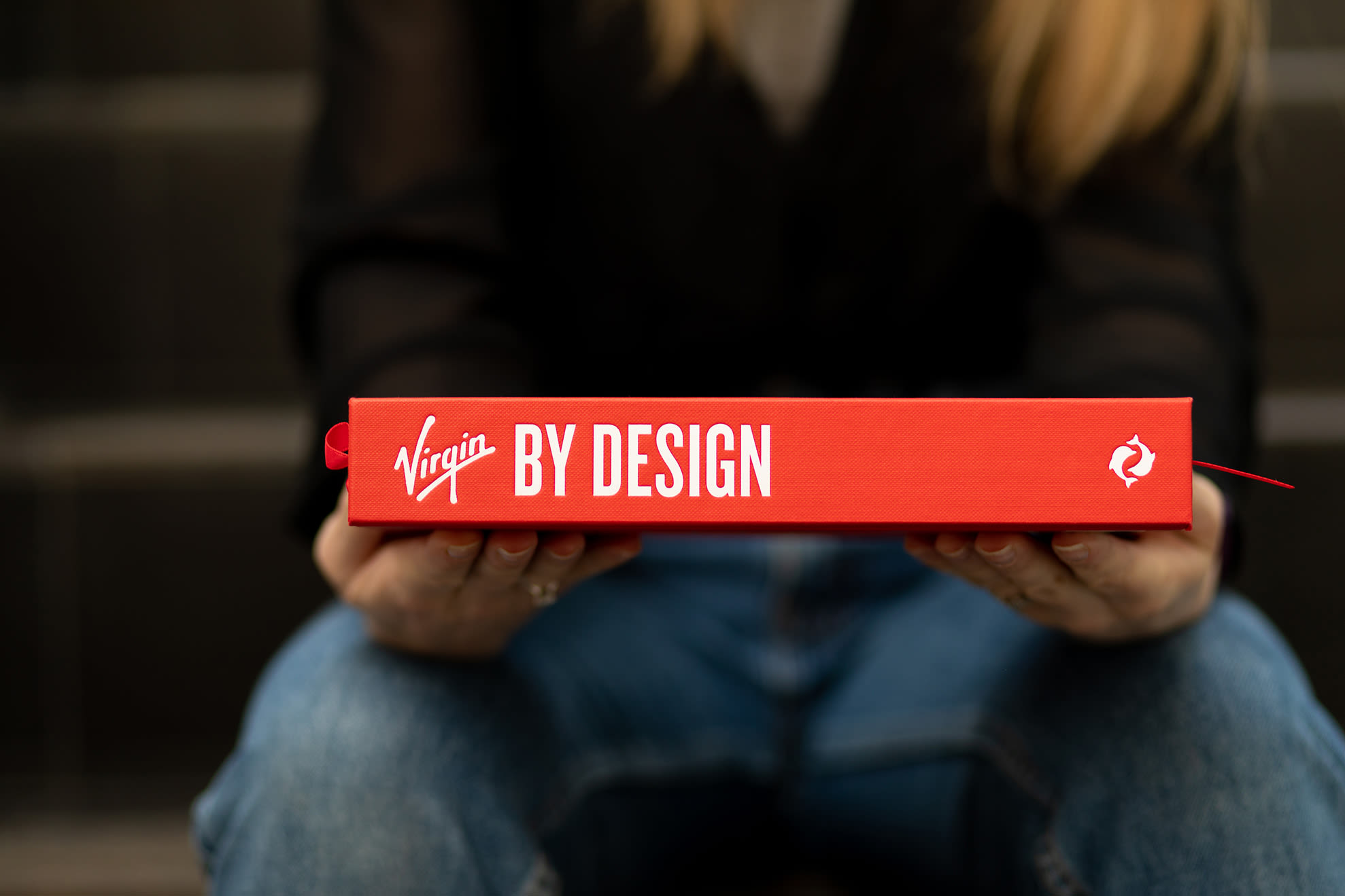 A woman holds a copy of Virgin By Design