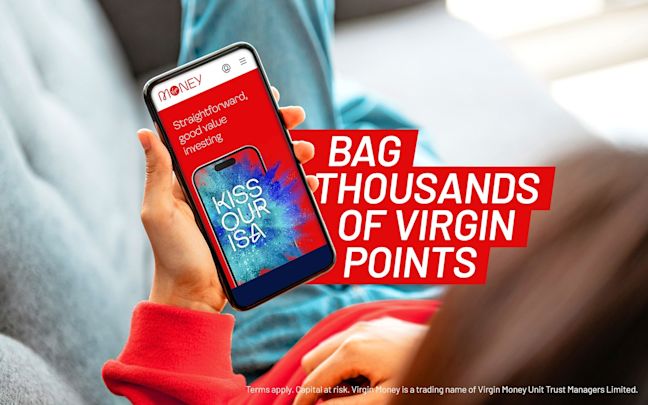 An image of a woman looking at the Virgin Money app on her phone. An image of a woman looking at the Virgin Money app on her phone.