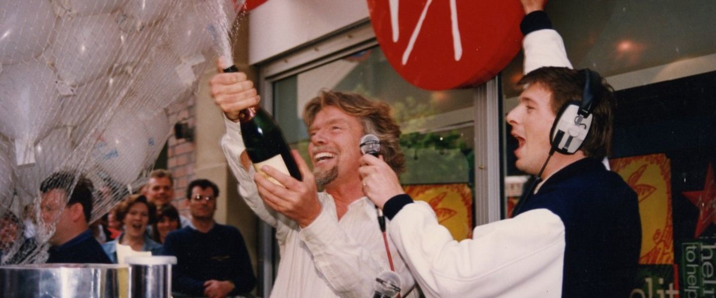 Richard Branson launching Virgin Radio UK with champagne in 1993