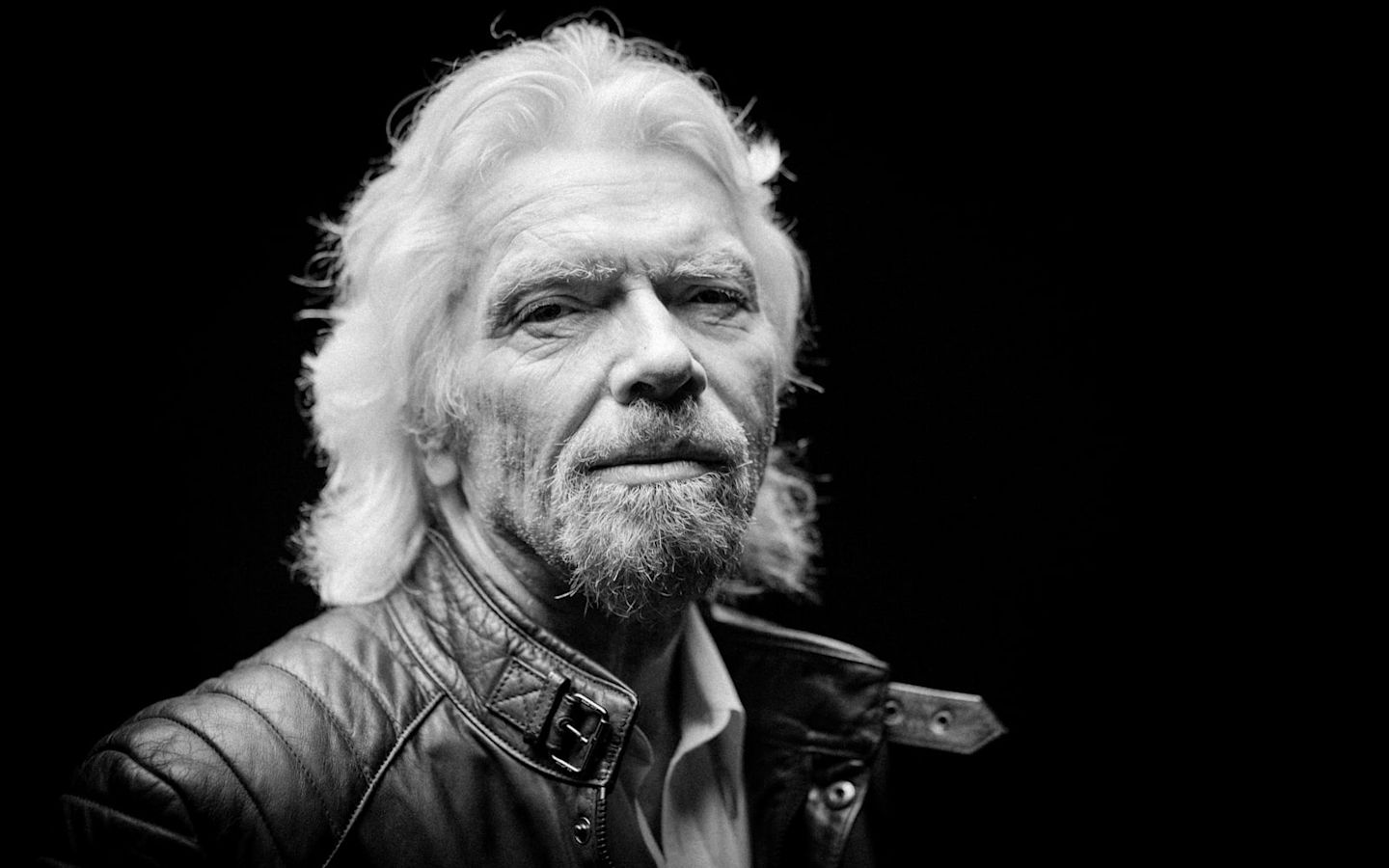 Black and white headshot of Richard Branson looking serious