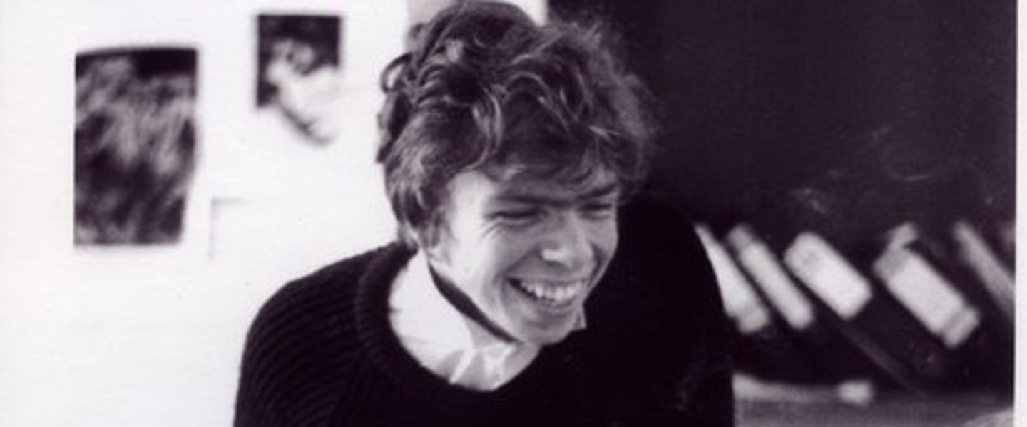 Black and white photo of a young Richard Branson smiling