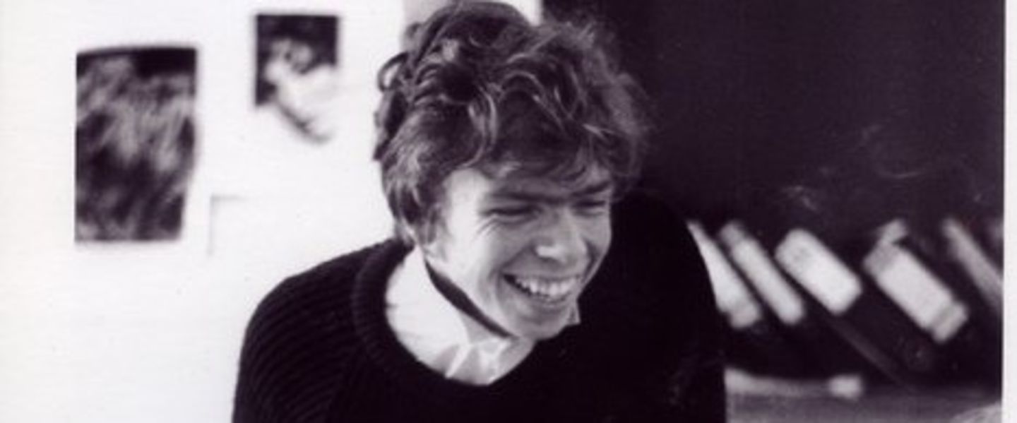 Black and white photo of a young Richard Branson smiling