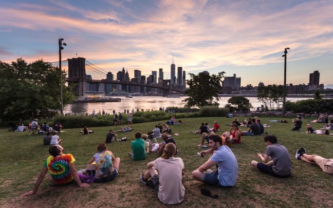 An image of a group of people enjoying the sunset in New York