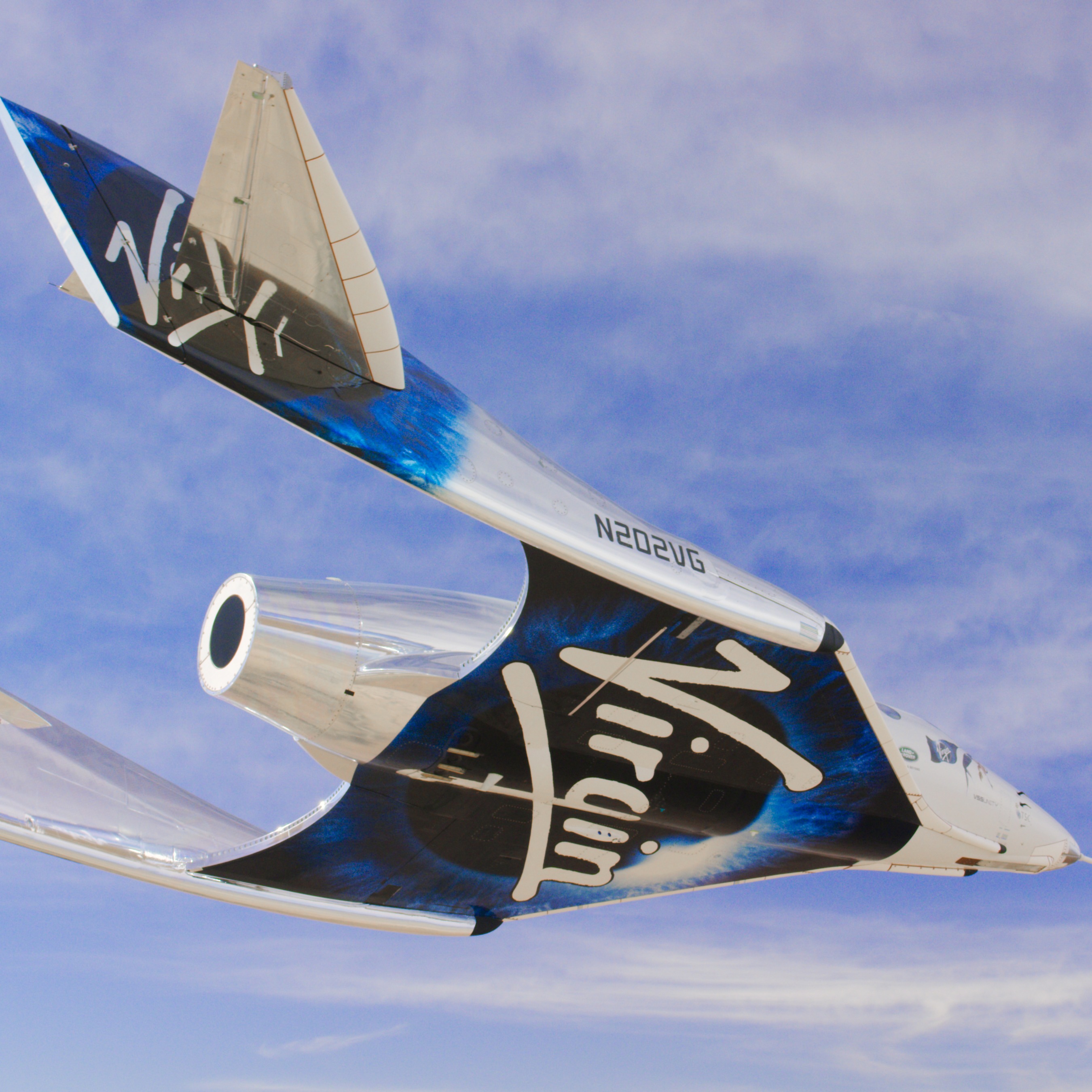 Virgin Galatic's SpaceshipTwo glides through the sky
