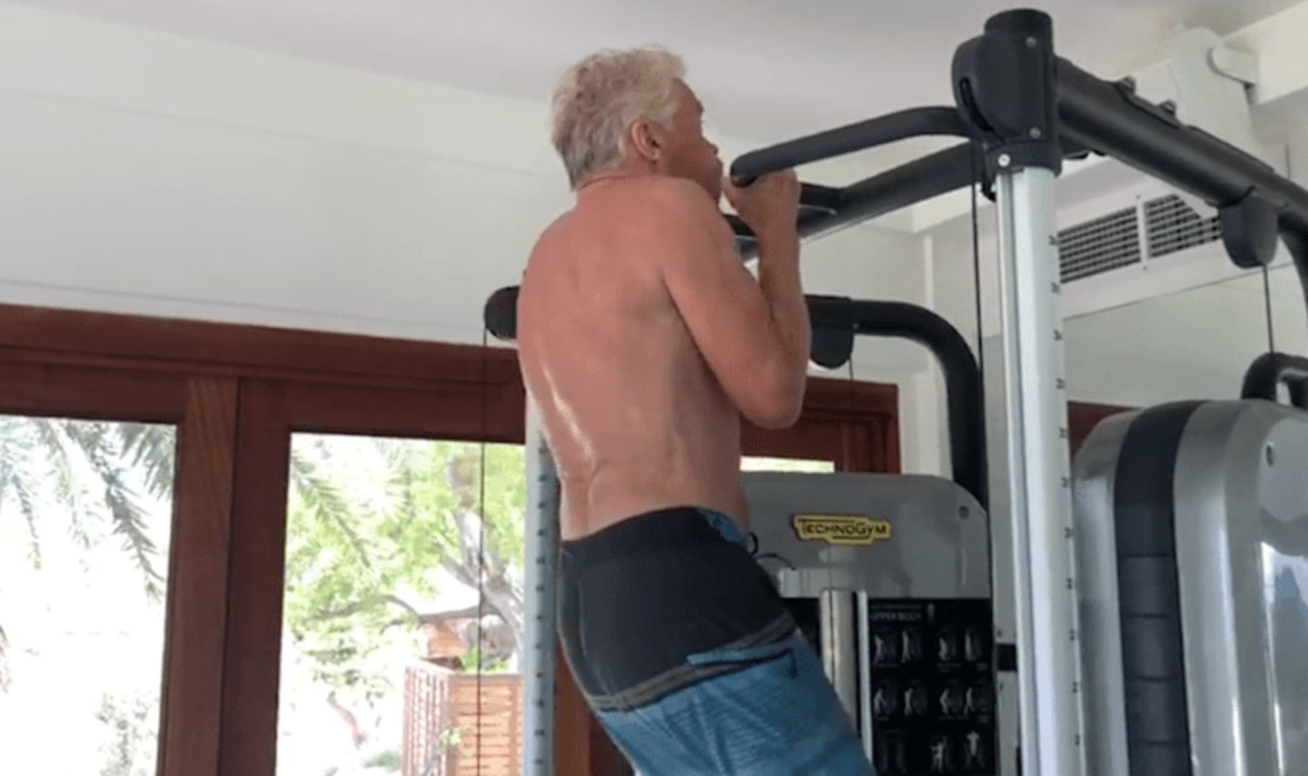 Richard Branson doing pull ups