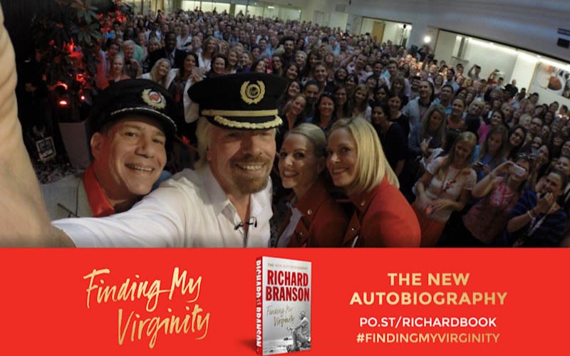 Richard Branson selfie with group with Finding My Virginity banner