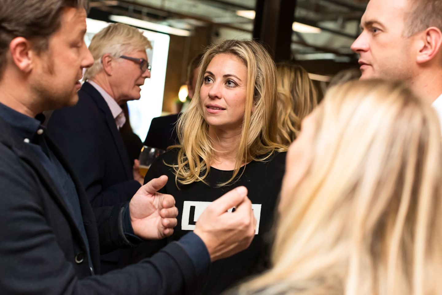 Holly Branson and Freddie Andrewes speaking to Jamie Oliver