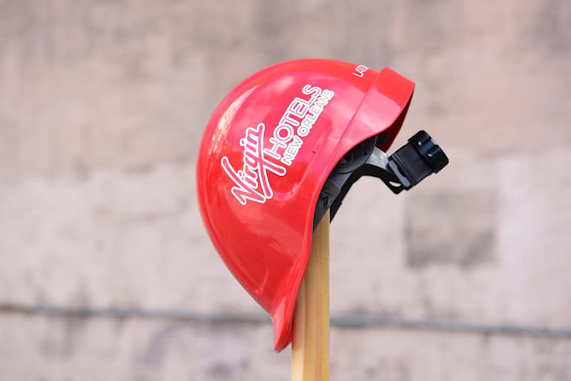A builders hat with Virgin Hotels New Orleans logo