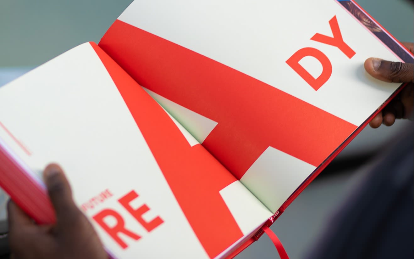 Virgin By Design book opened at a page that says 'Ready' in red lettering