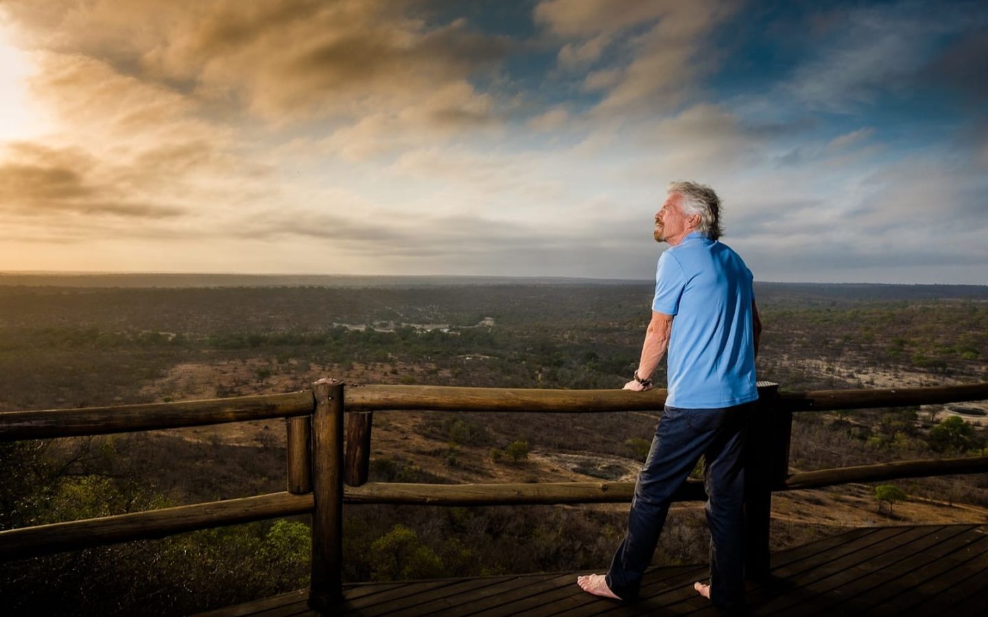 Richard Branson on the balcony at the Ulusaba property during sunset