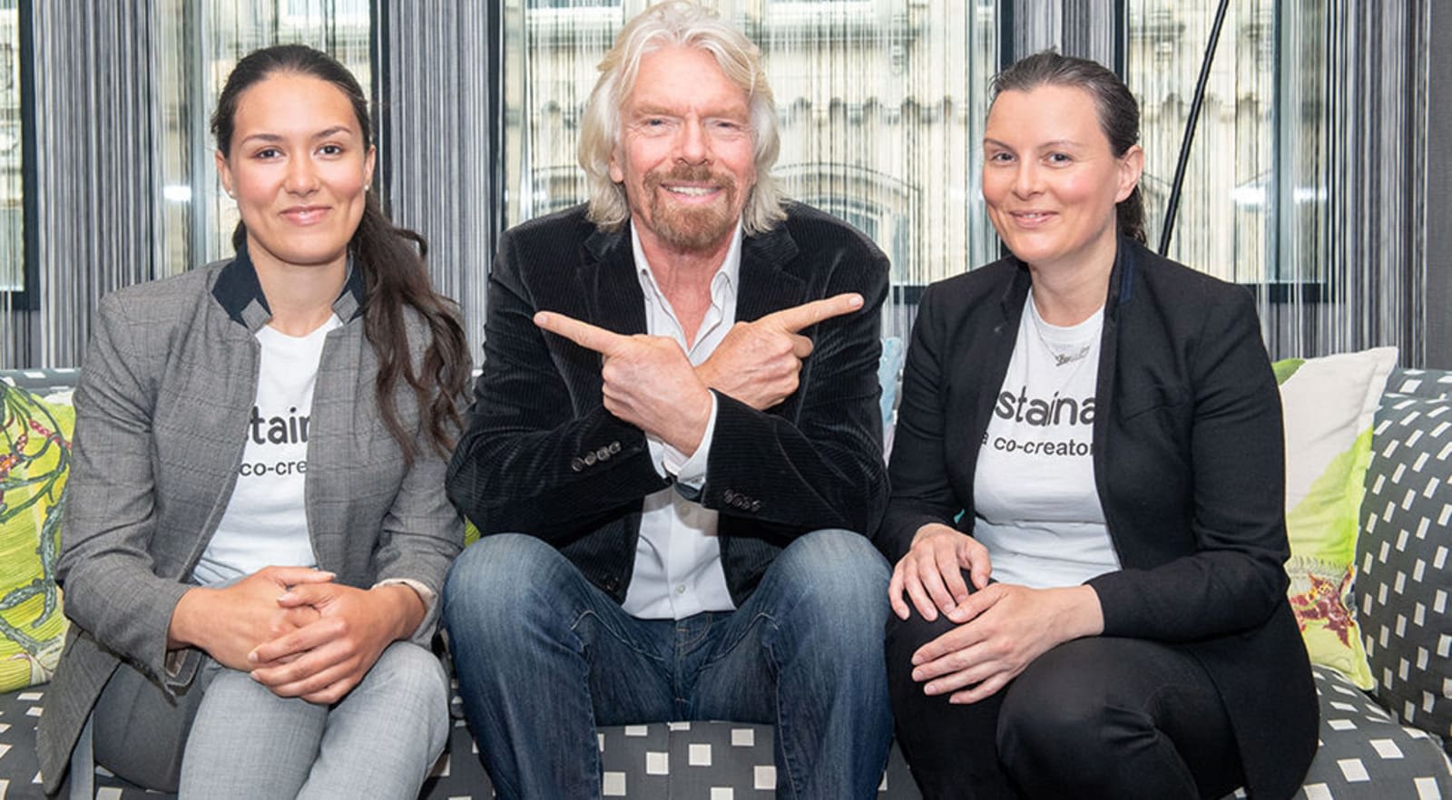 Richard Branson with the founders of the Sustainably app 