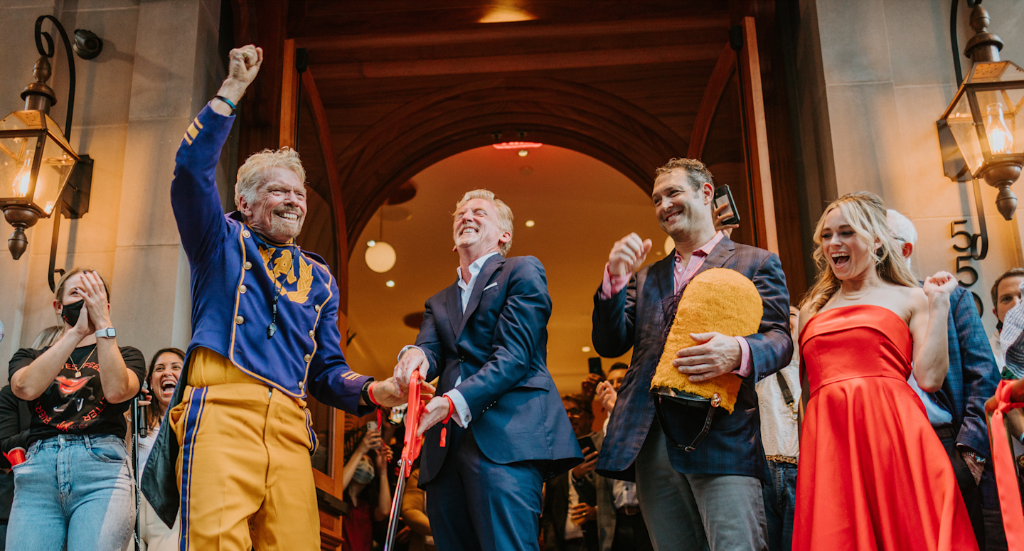 Richard Branson cutting the ribbon to open Virgin Hotels New Orleans