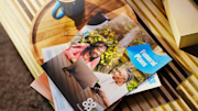 Funeral plan brochure on a table with a cup of tea.