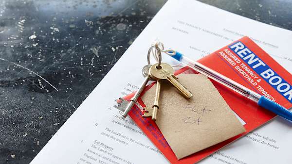 House keys on top of a tenancy agreement.