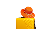 Orange hat on yellow suitcase