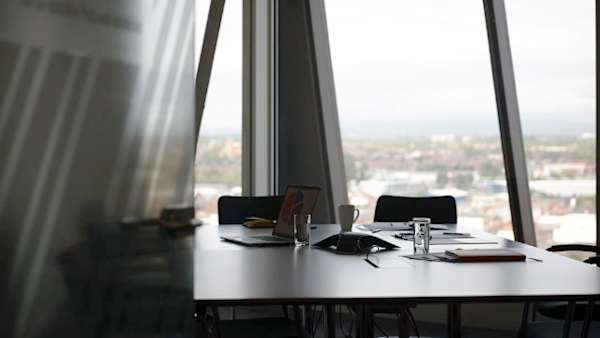 A meeting room in a high rised building.