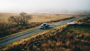 Car driving along open road in the countryside