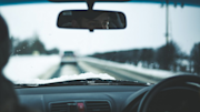 Person driving a car in the winter