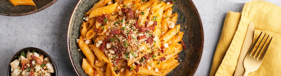 Romige pompoenpasta met krokant spek