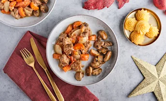 Kruidige runderstoof met pommes duchesses en champignons