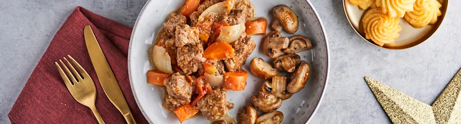 Kruidige runderstoof met pommes duchesses en champignons