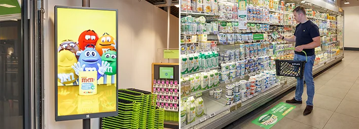 Digitale advertentie voor M&M's in een PLUS supermarkt, naast een klant die zuivelproducten bekijkt.