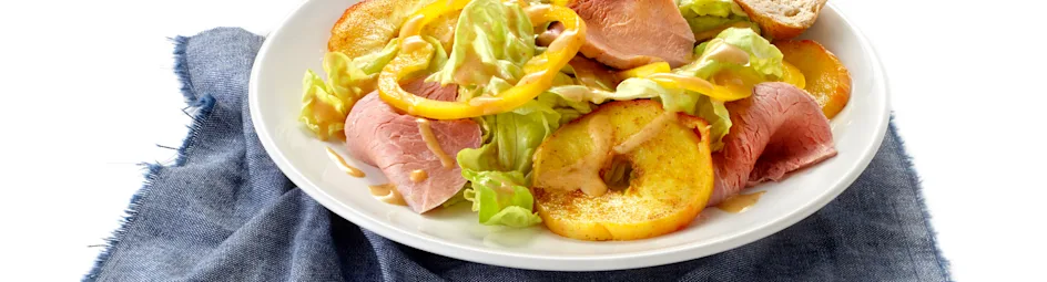 Beenhamsalade met warme appel en currydressing