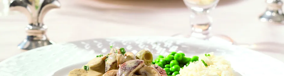 Kalfslapjes met champignons in mosterdsaus