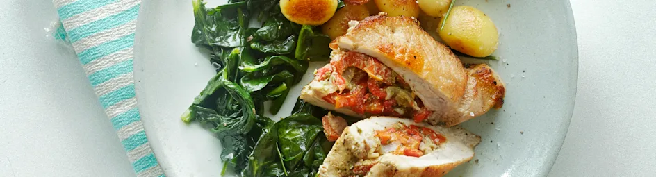 Gevulde varkensfilet met knoflookspinazie en rozemarijnkrieltjes