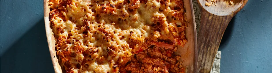 Gegratineerde couscous met ham en tomaat