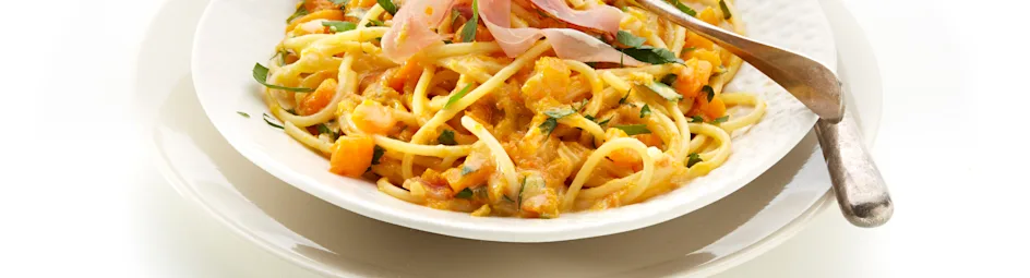 Pasta met pompoen en rauwe ham