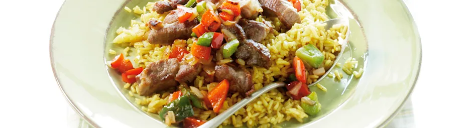 Geroosterde varkenslapjes met kerrierijst