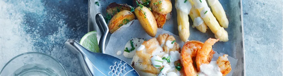 Gebakken kabeljauw met gewokte garnalen en vanillesaus