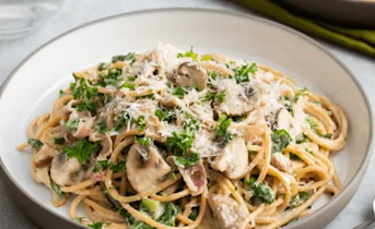 Spaghetti carbonara met champignons en boerenkool