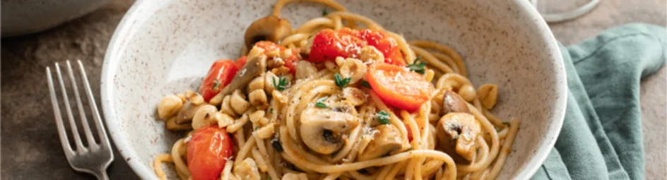 Spaghetti met champignons en hazelnoten