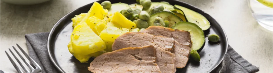 Geroosterde beenham met aardappelgratin en courgette