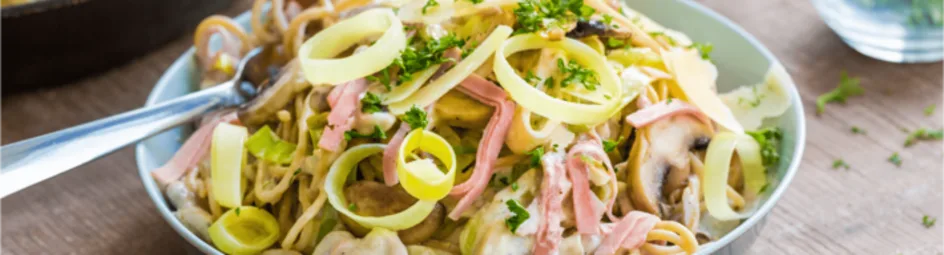 Spaghetti met champignon-roomsaus en ham