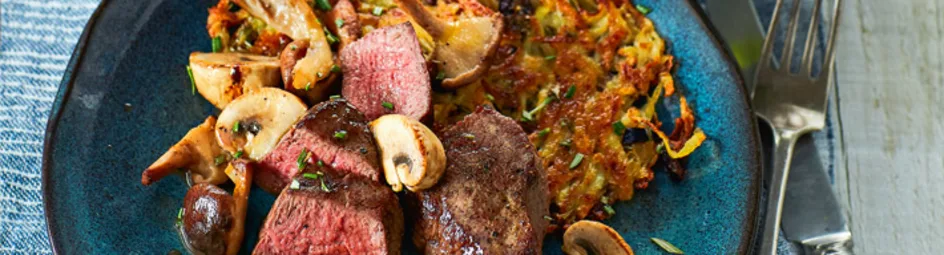 Wildzwijnmedaillons met aardappelgalette en paddenstoel