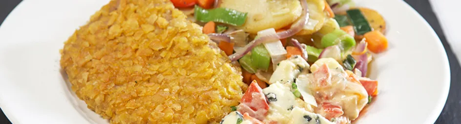 Oostenrijkse gehaktschnitzels met aardappelschijfjes en roerbakgroenten