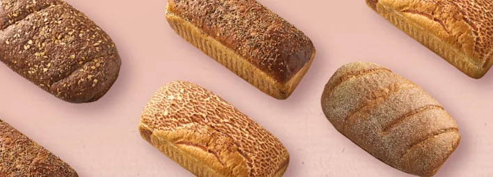 Verschillende soorten Korenlanders brood op een roze achtergrond.