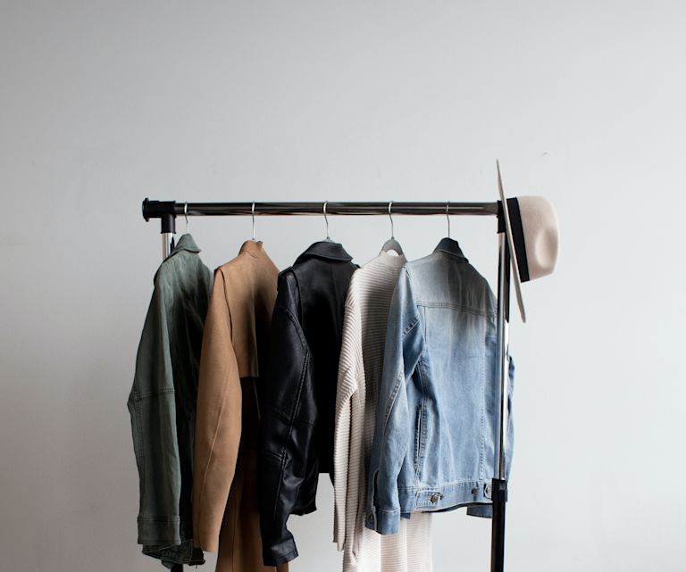 Stylish clothes on a rack