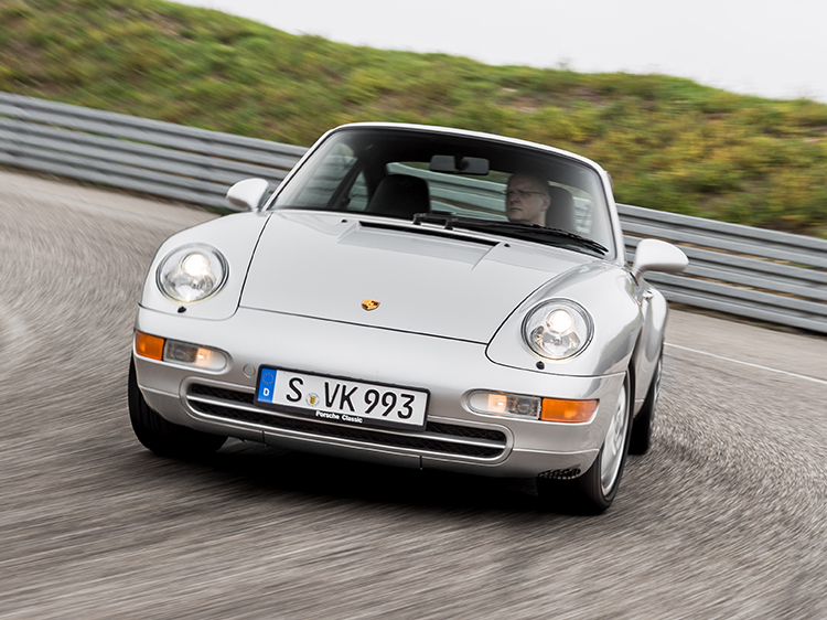 Front view of Porsche 911 (type 993) driving on track