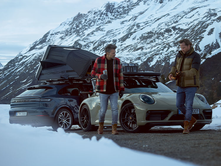 Men with Porsche cars featuring Porsche winter camping equipment