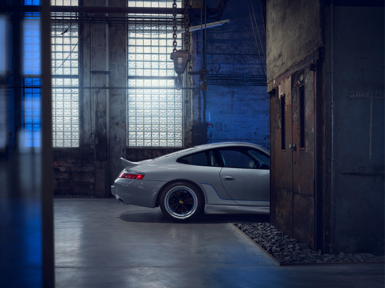 Porsche 911 Classic Club Coupe in dark, industrial warehouse