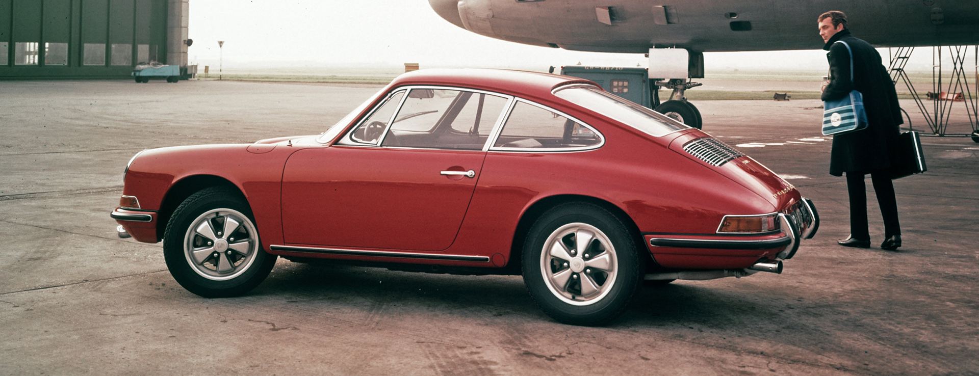 1967 Porsche 911 S 2.0 Coupe beside aeroplane