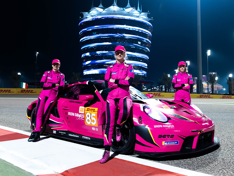 Iron Dames with pink 911 RSR at night on track