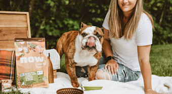 NF - In blog Image - Bull dog and woman having picnic in park