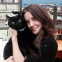 Magda Romanow holding black cat