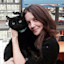 Magda Romanow holding black cat