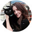 Magda Romanow holding black cat